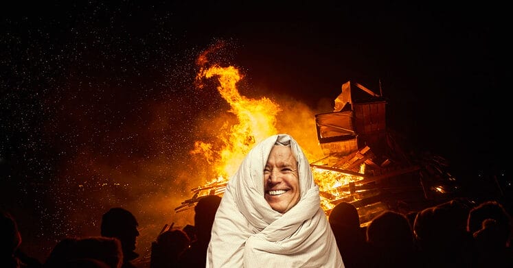 President Joe Biden wrapped in a blanket, trying to stay warm in front of a wood-burning fire.