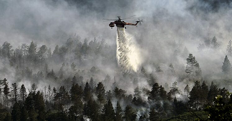 A helicopter drops water on the fire as firefighters continued to battle the blaze that burned into the evening hours in Waldo Canyon on the U.S. Air Force Academy June 27, 2012. The fires, which have burned more than 15,000 acres, began spreading to the southwestern corner of the Academy in the early morning, causing base officials to evacuate residents. Officials estimated that the fire had spread to about 10 acres of land belonging to the Academy.
Currently, more than 90 firefighters from the Academy, along with assets from Air Force Space Command; F.E. Warren Air Force Base, Wyo.; Fort Carson, Colo.; and the local community continue to fight the fire.(U.S. Air Force Photo by: Master Sgt. Jeremy Lock) (Released)