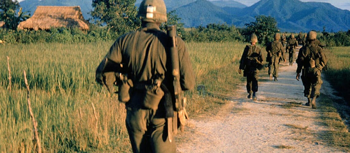 Vietnam War 1957 - 1975 American soldiers on a patrol South Vietnam 1965 equipment equipments road roads dirt path dirt track